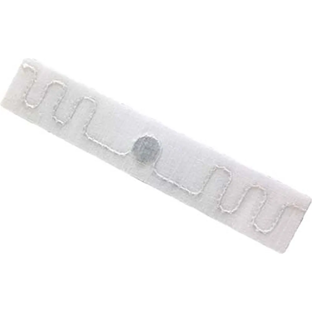 White washable fabric UHF RFID laundry tag with stitched wave antenna and chip, 70 × 15 mm